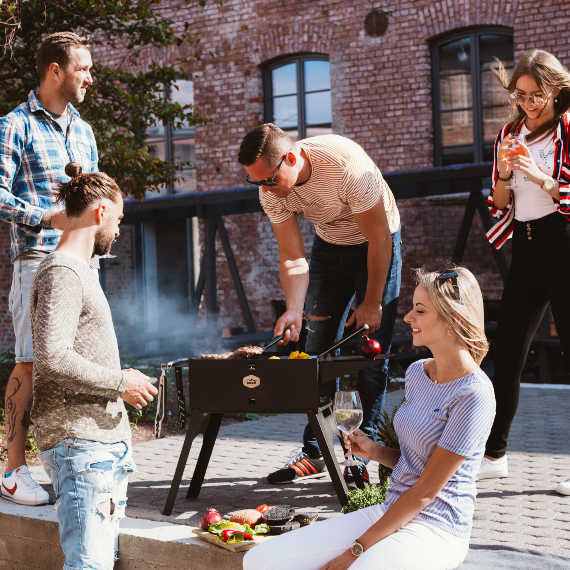 small portable grill with travel friendly case of laptop