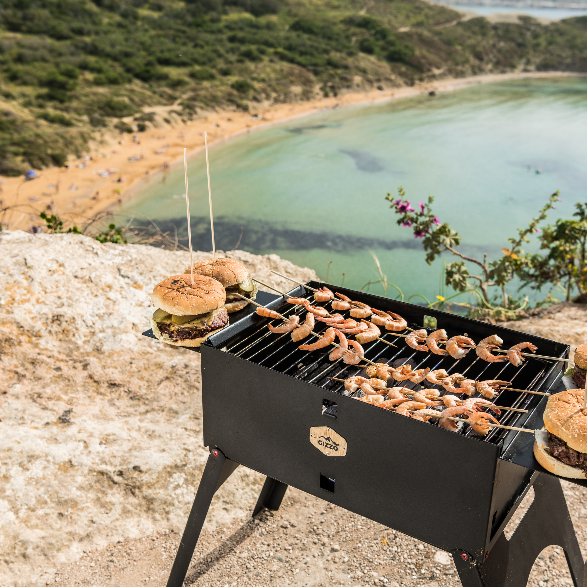 small portable grill with travel friendly case of laptop