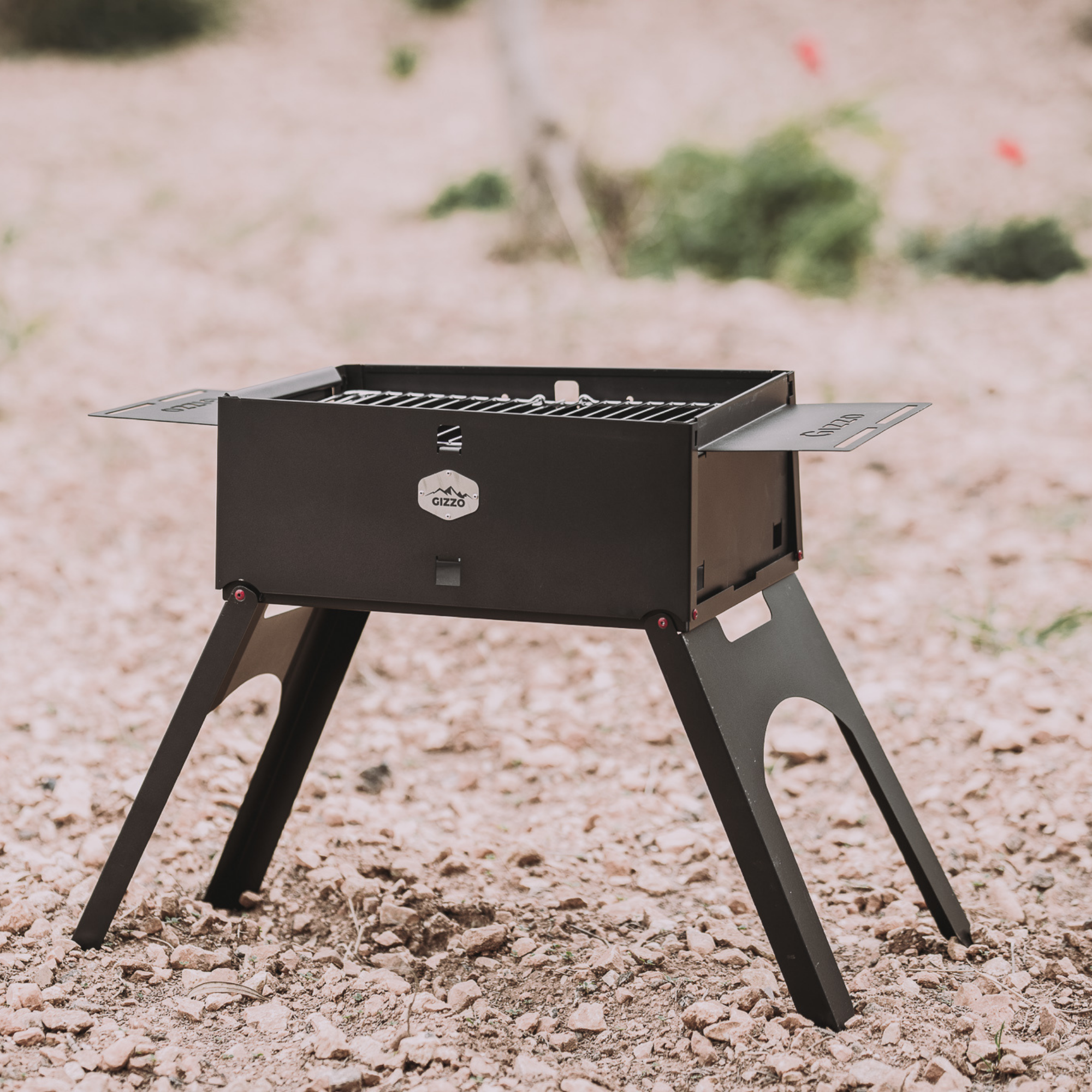 small portable grill with travel friendly case of laptop