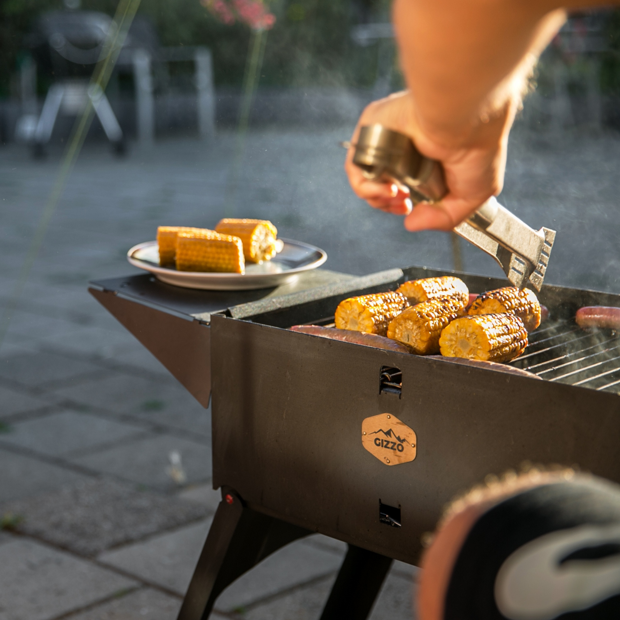 small portable grill with travel friendly case of laptop