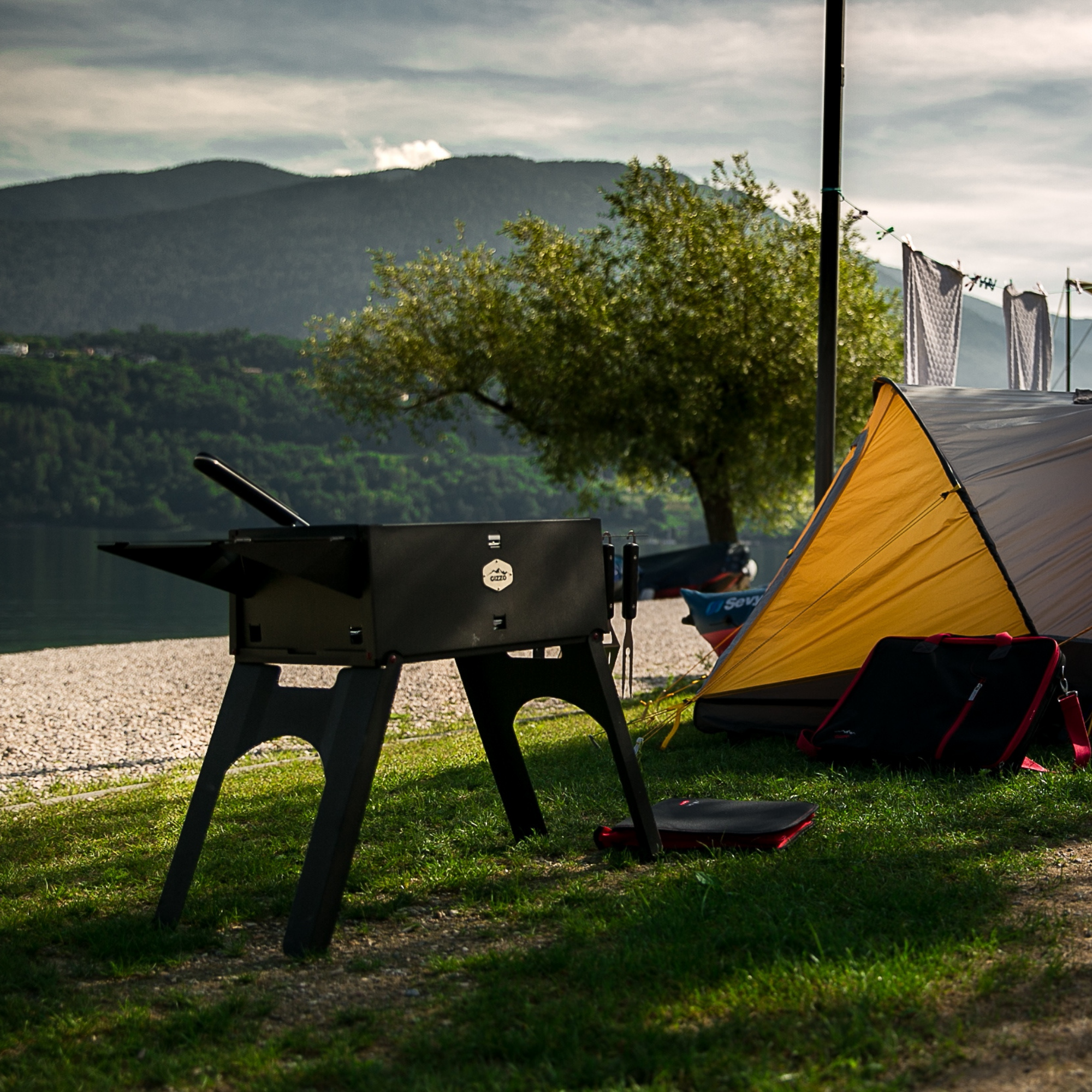 small portable grill with travel friendly case of laptop